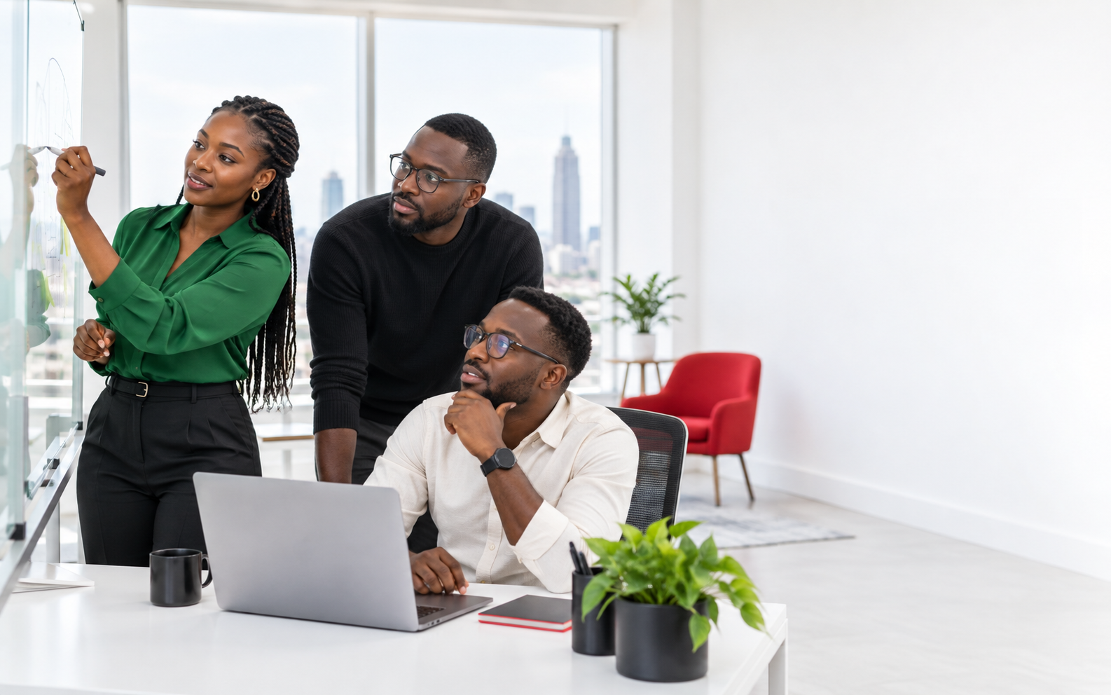 Software professionals planning a solution together at a whiteboard
